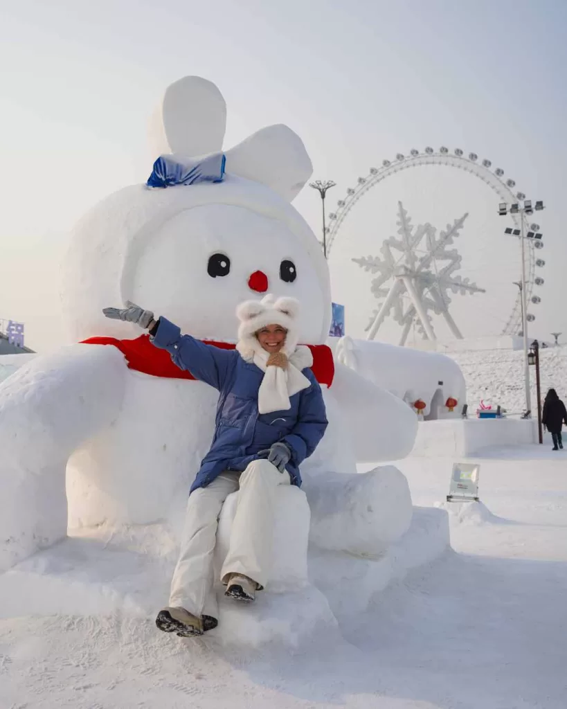 Harbin Snow and Ice Festival Image of snowman and snowflake ferris wheel